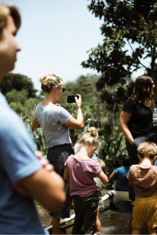 Woman taking picture with smart phone