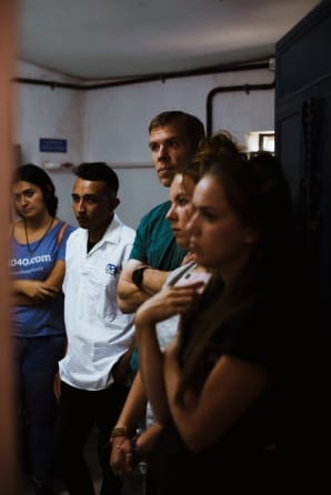 Group of volunteers listening intently