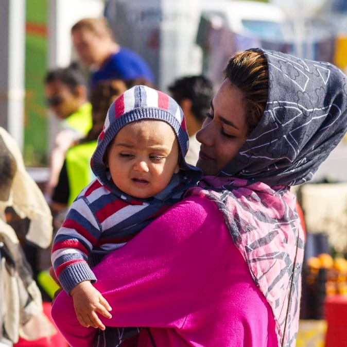 Woman holding baby in arms